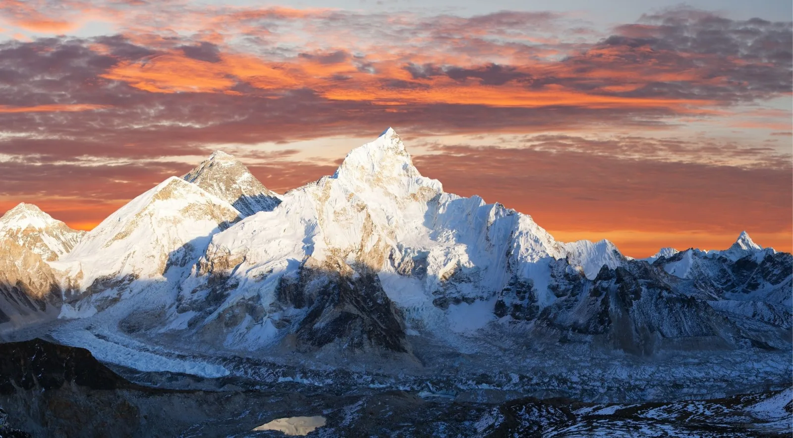 Everest and Nuptse lit gold at sunset, seen from Kala Patthar